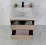Bathroom vanity with sink and open drawer on a marble floor