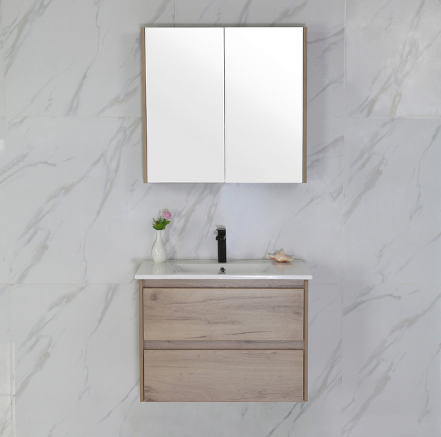 Bathroom vanity with mirror and sink against a marble wall