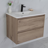 Bathroom vanity with wooden cabinet, white countertop, and black faucet.