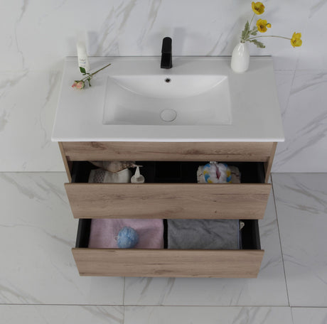 Bathroom vanity with open drawer, sink, and decorative items on a marble floor.
