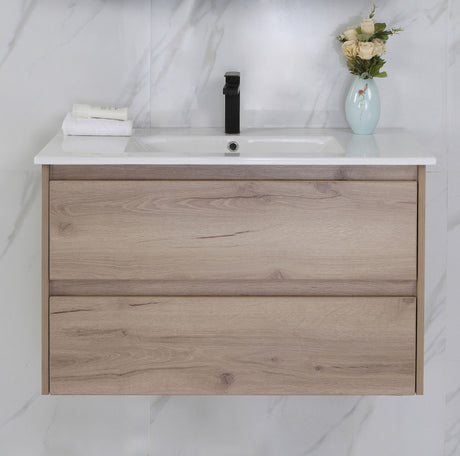 Bathroom vanity with wooden finish, white countertop, and decorative elements.