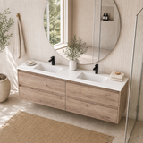 A modern floating double-sink bathroom vanity with a light oak wood finish and white countertop, shown in a bright, sunlit bathroom setting with a large round mirror and a glass shower door.