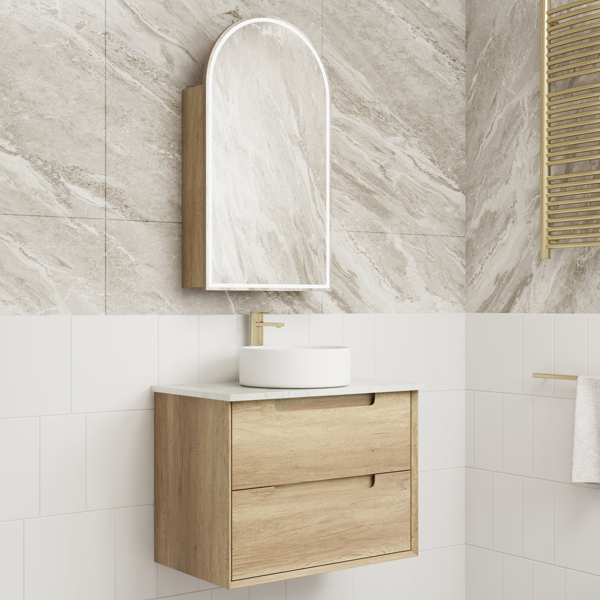 Bathroom vanity with wooden cabinet, white sink, and mirror against a tiled wall.