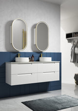 Bathroom with white vanity, two sinks, and oval mirrors against a blue tiled wall.