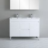 White bathroom vanity with two sinks against a gray wall.