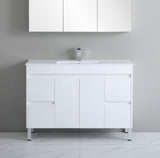White bathroom vanity with sink against a gray wall