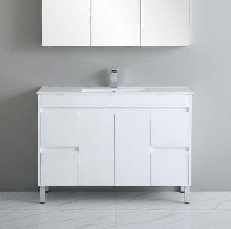 White bathroom vanity with sink against a gray wall