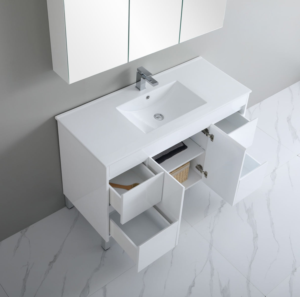 White bathroom vanity with sink and mirror on a marble floor