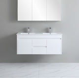 White bathroom vanity with double sink and cabinets on a gray wall.