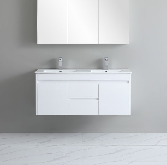 White bathroom vanity with double sink and cabinets on a gray wall.