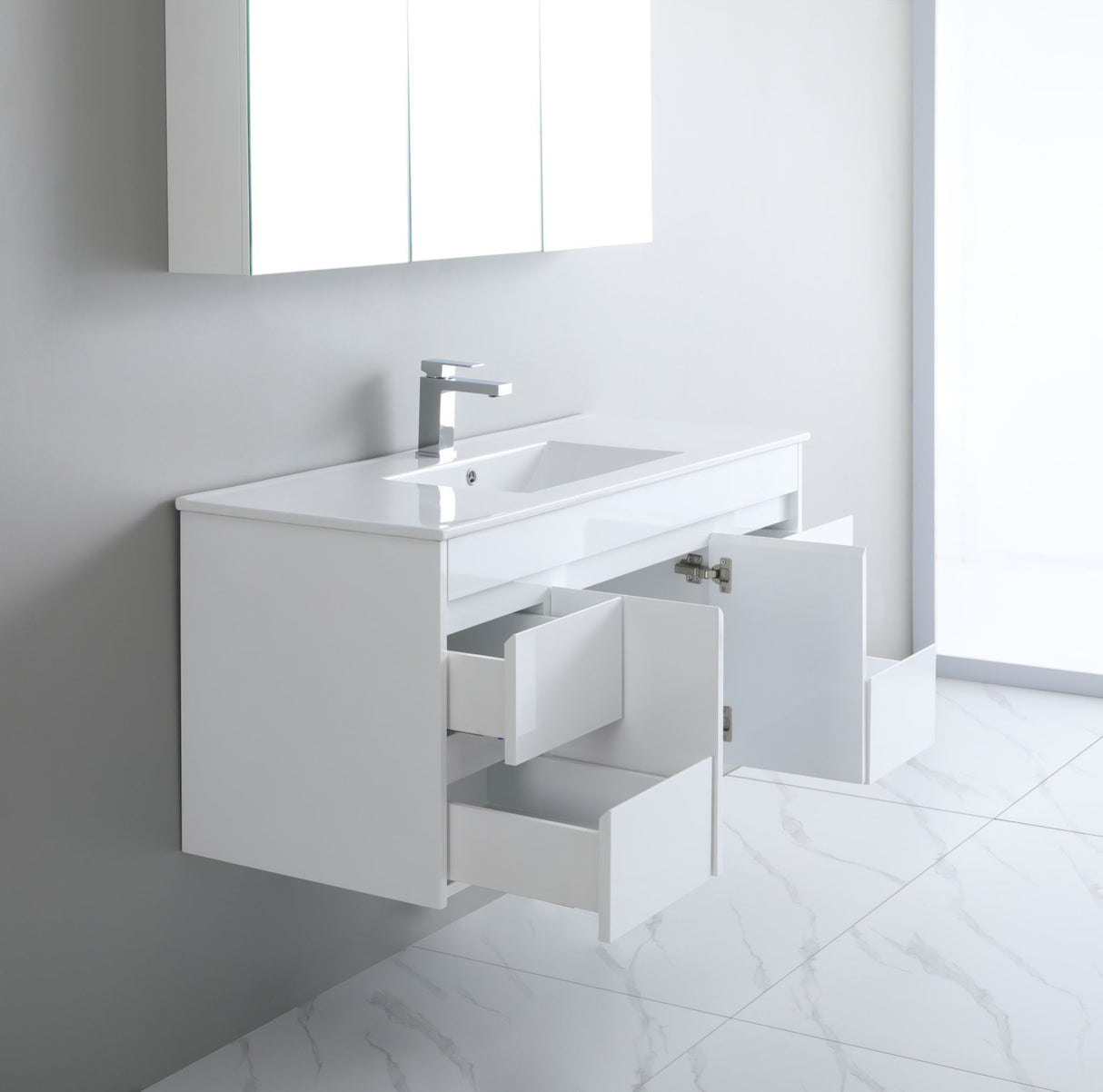 White bathroom vanity with open drawer in a bright room