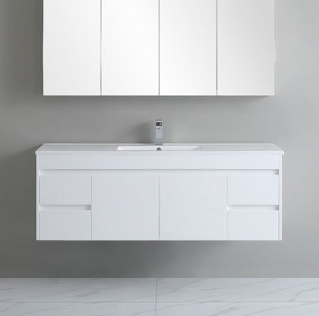 White bathroom vanity with sink and cabinets against a gray wall.