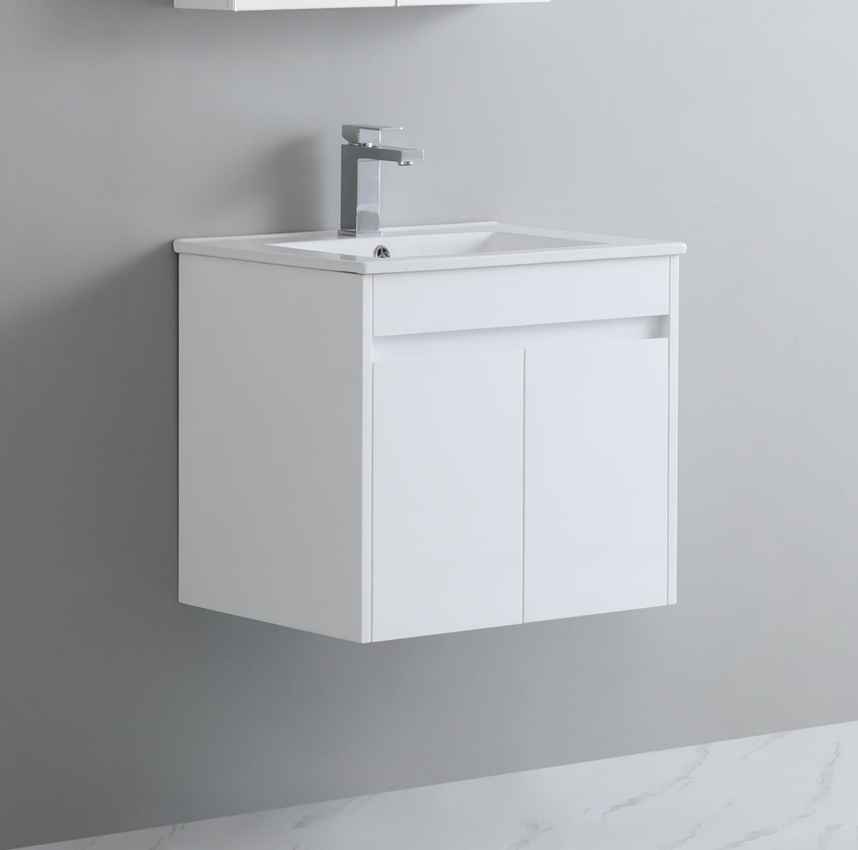 White wall-mounted vanity with sink against a gray wall