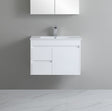 White bathroom vanity with sink against a gray wall