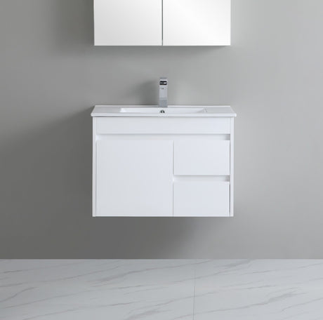 White bathroom vanity with sink against a gray wall