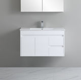 White bathroom vanity with sink and cabinet on a gray wall background