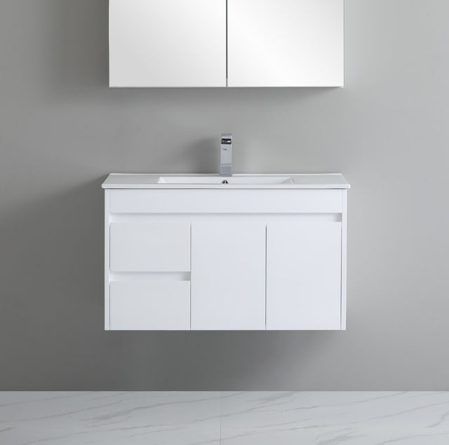 White bathroom vanity with sink against a gray wall