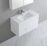 White bathroom vanity with sink and mirror in a modern setting