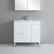 White bathroom vanity with sink against a gray wall