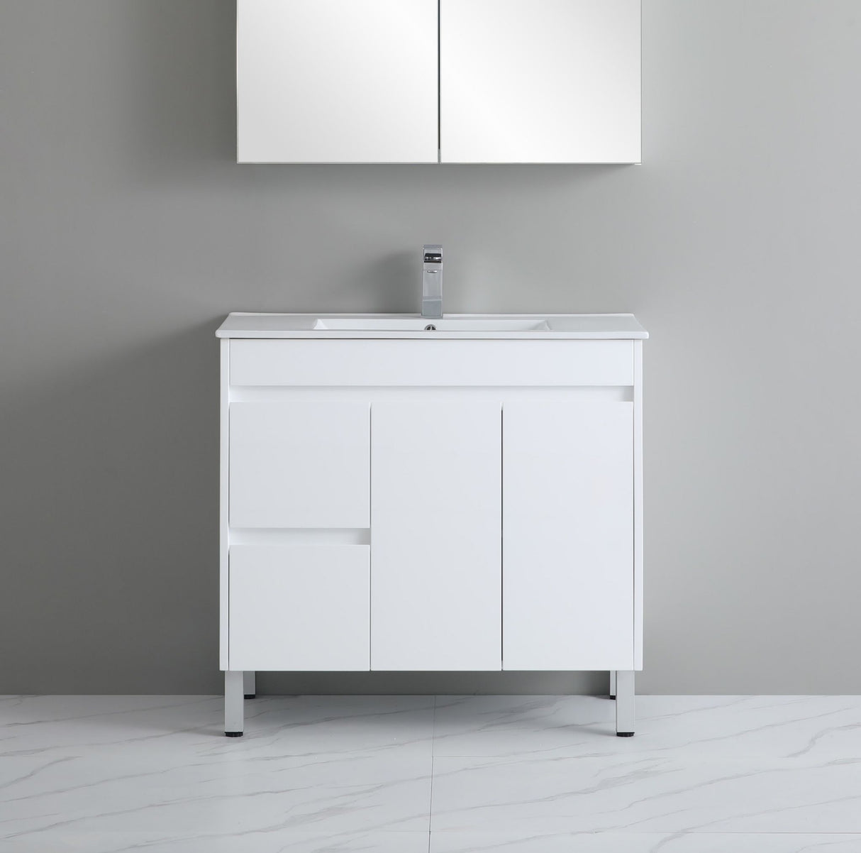 White bathroom vanity with sink against a gray wall