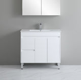 White bathroom vanity with sink against a gray wall