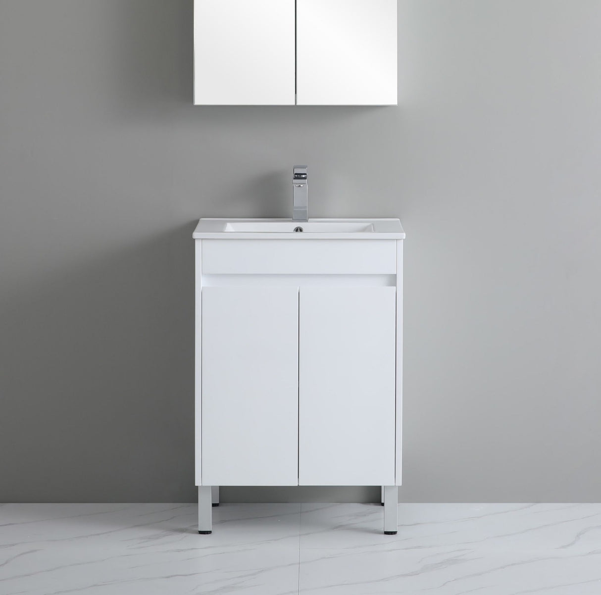 White bathroom vanity with sink against a gray wall