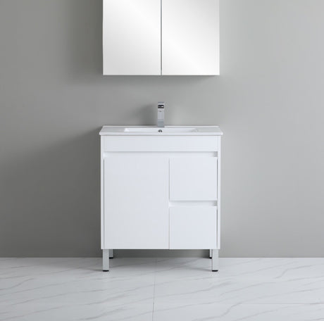 White bathroom vanity with sink against a gray wall