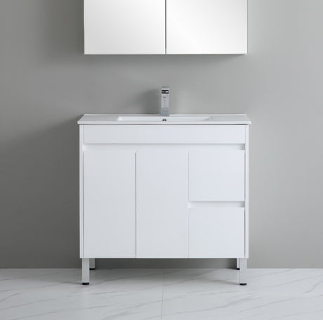 White bathroom vanity with sink against a gray wall
