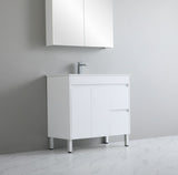 White bathroom vanity with sink against a gray wall
