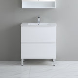 White bathroom vanity with sink against a gray wall