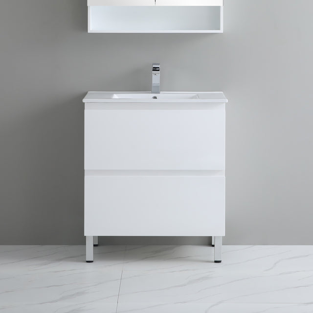 White bathroom vanity with sink against a gray wall