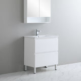 White bathroom vanity with sink and mirror cabinet against a gray wall.