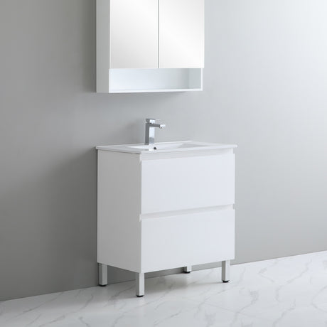 White bathroom vanity with sink and mirror cabinet against a gray wall.