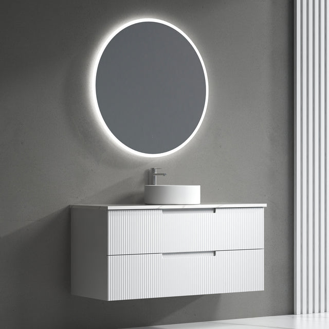 Bathroom vanity with round illuminated mirror on a gray wall