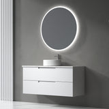 Bathroom vanity with round illuminated mirror on a gray wall