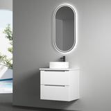 Bathroom vanity with sink and illuminated mirror against a gray wall.