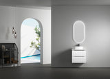Modern bathroom with a vanity unit and illuminated mirror.