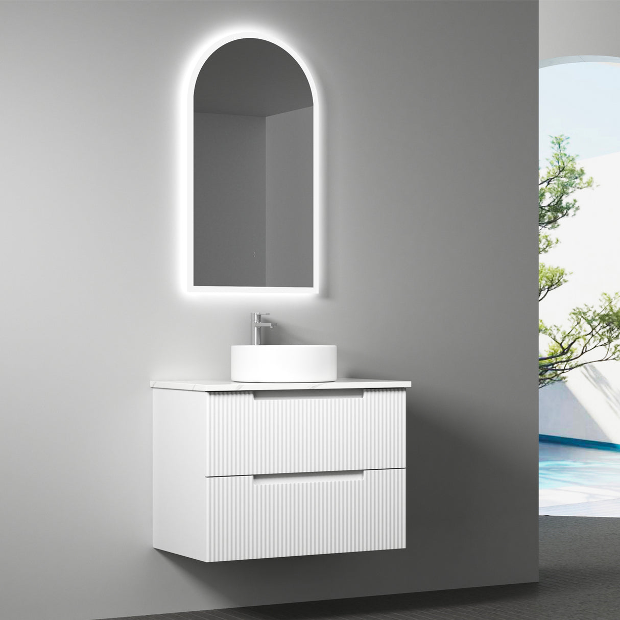 Bathroom vanity with sink and illuminated mirror against a gray wall.