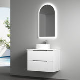 Bathroom vanity with illuminated mirror in a modern setting