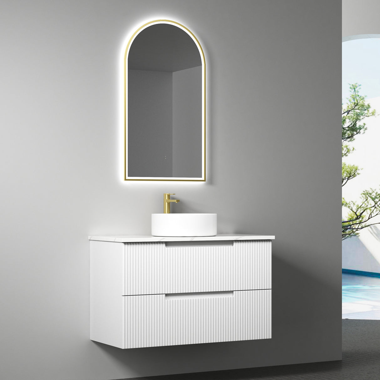 Bathroom vanity with illuminated mirror and sink against a gray wall.