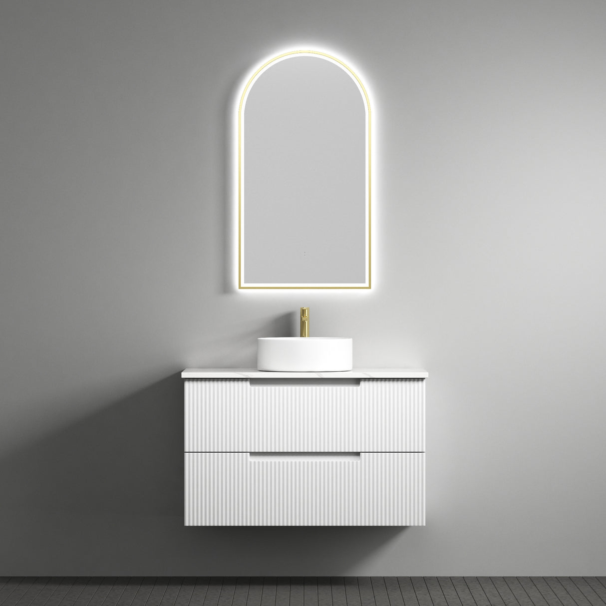 Bathroom vanity with sink and illuminated mirror against a gray wall