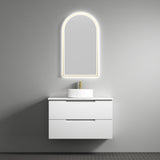 Bathroom vanity with sink and illuminated mirror against a gray wall