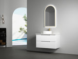 Bathroom vanity with illuminated mirror and sink in a modern setting.
