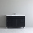 Black bathroom vanity with white countertop against a gray wall