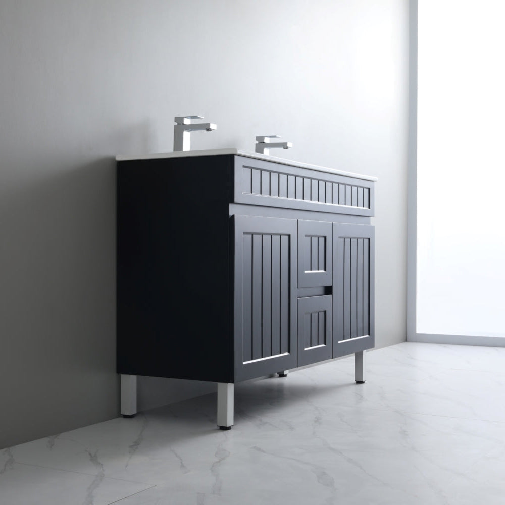 Bathroom vanity with two sinks against a gray wall.
