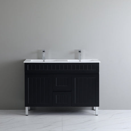 Black bathroom vanity with white countertop against a gray wall