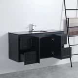 Black bathroom vanity with open cabinet doors in a bathroom setting