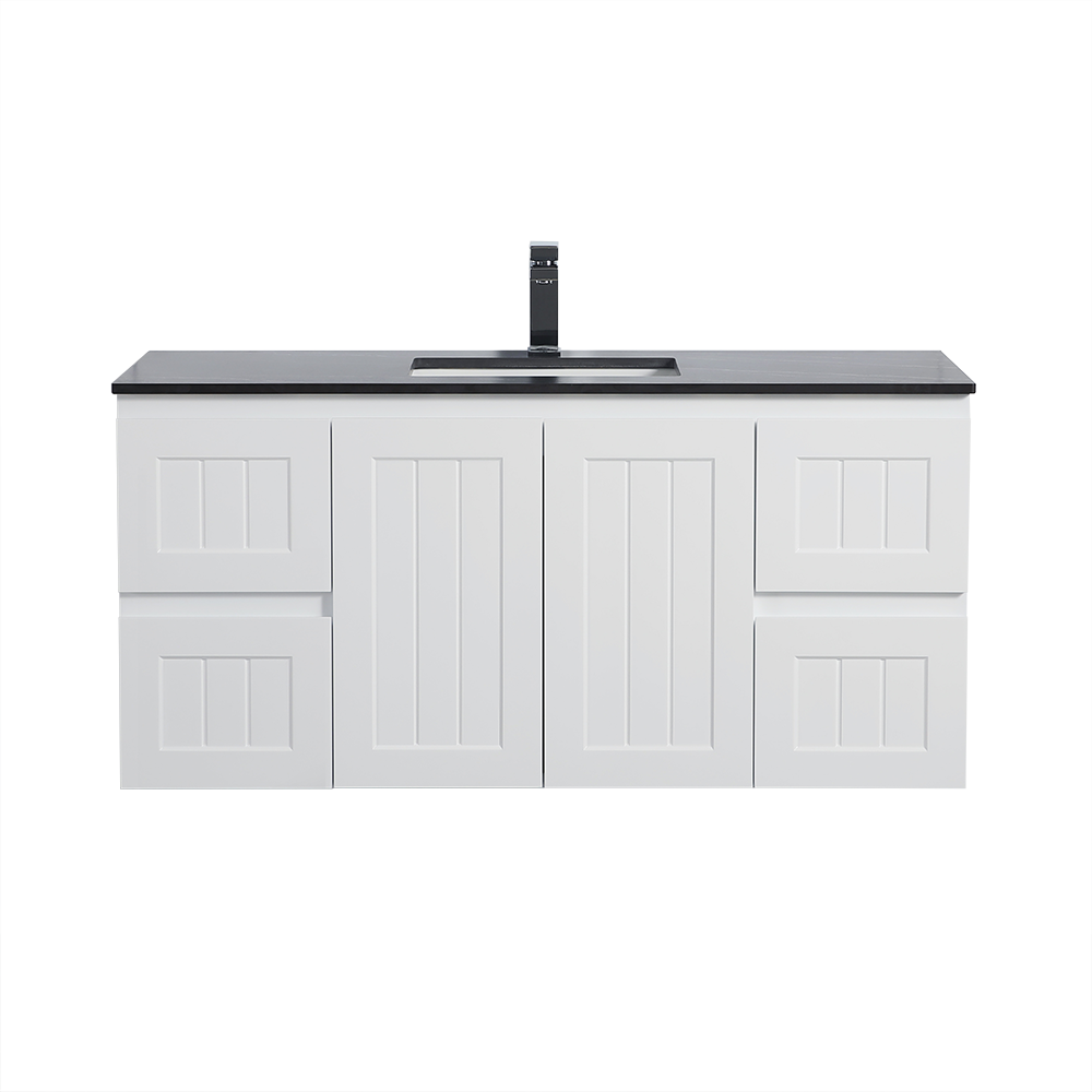White bathroom vanity with black countertop and faucet on a white background