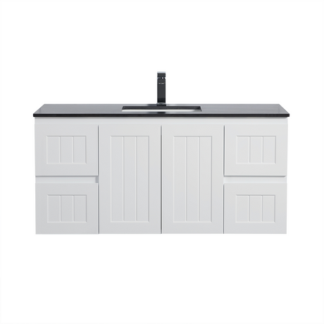 White bathroom vanity with black countertop and faucet on a white background