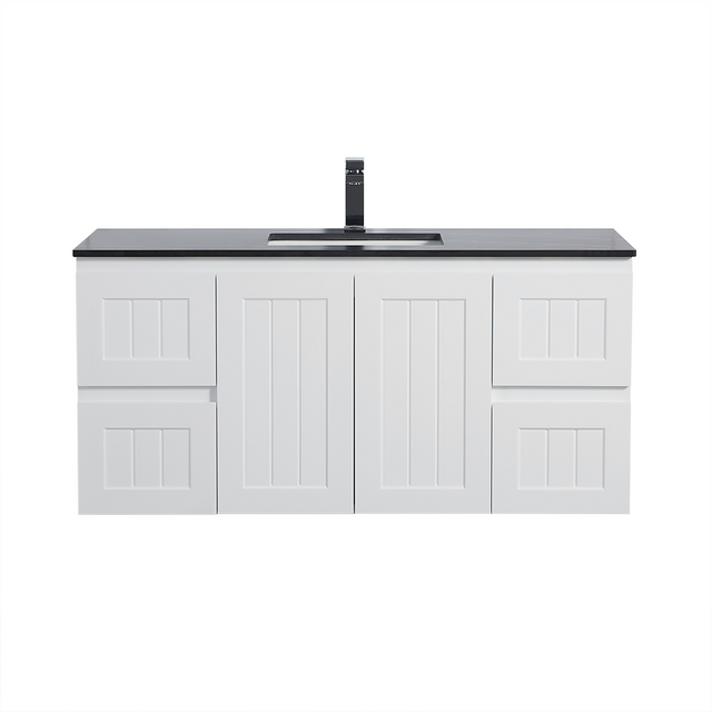 White bathroom vanity with black countertop and faucet on a white background